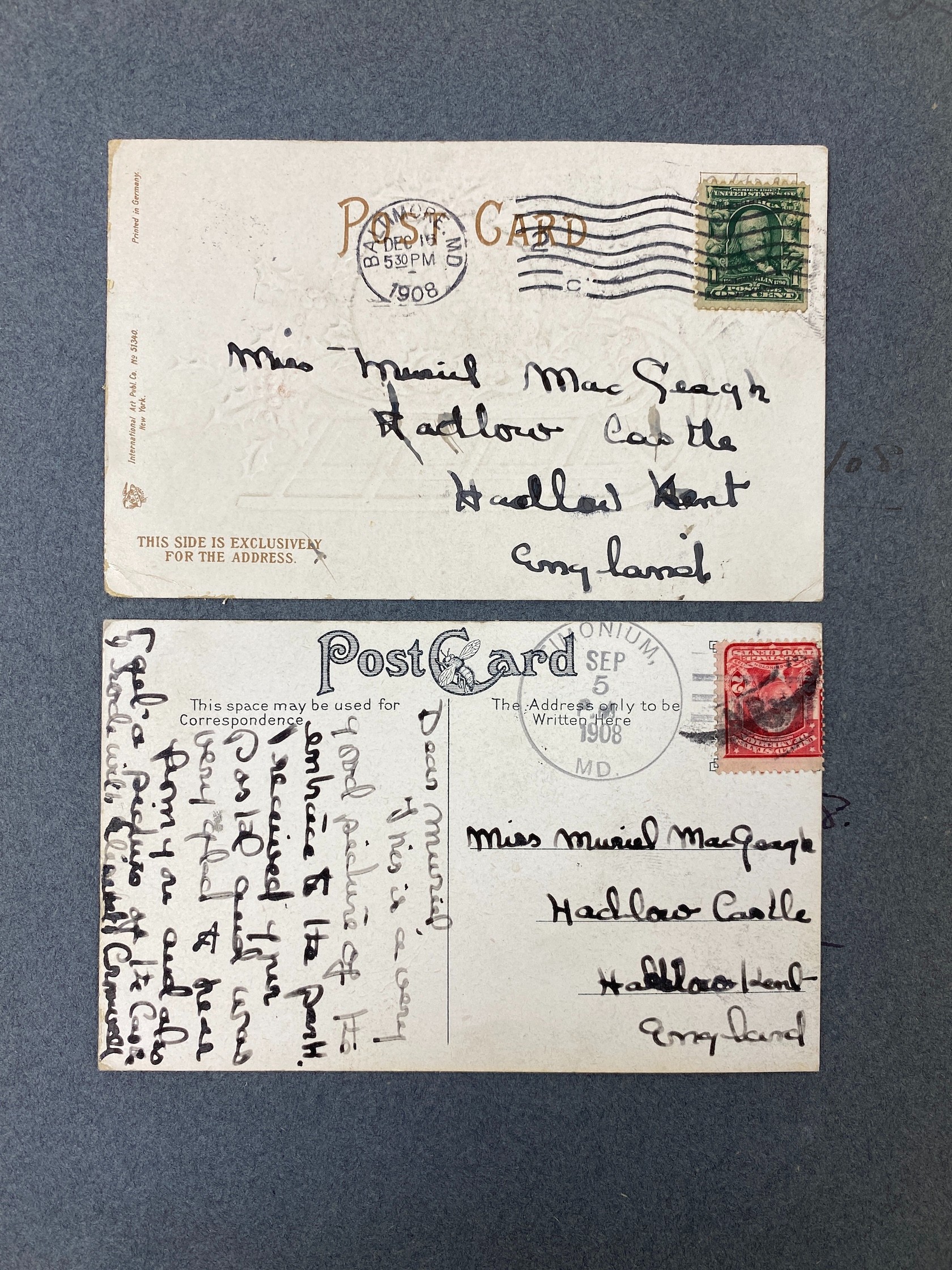 Two Postcard albums - an Edwardian blue album, containing topographical views in Europe and the U.S.A, as collected by Muriel MacGeagh, sister of Col. Sir Henry F. MacGeagh, on the trip to America July 1907-March 1908, t